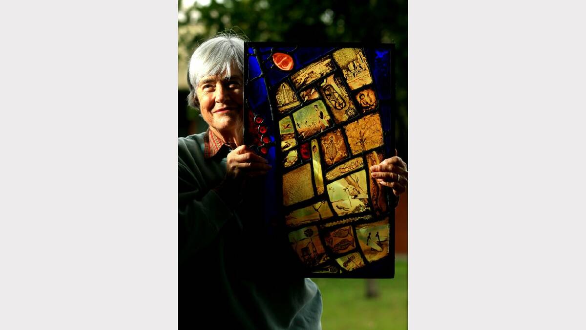Margaret Lamond holding a piece of stained glass work by late German Artist Guenter Kaminski. This work was inspired by Dorothea Mackellar's poem "My Country"  There will be an auction of Kaminski's works both in stained glass and paintings. Picture Simone De Peak