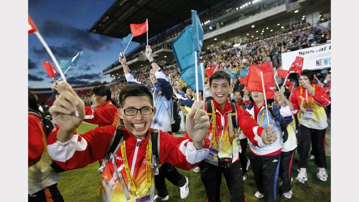 The opening ceremony of the Special Olympics on Sunday night.  Athletes from Hong Kong arrive at the stadium. Picture Jonathan Carroll