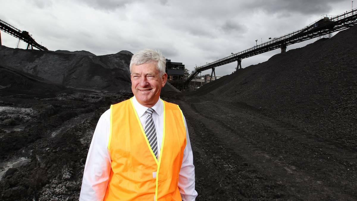 MODERN INDUSTRY: Managing Director John Richards stands among the family business's stockpile of coal. Picture : Ryan Osland
