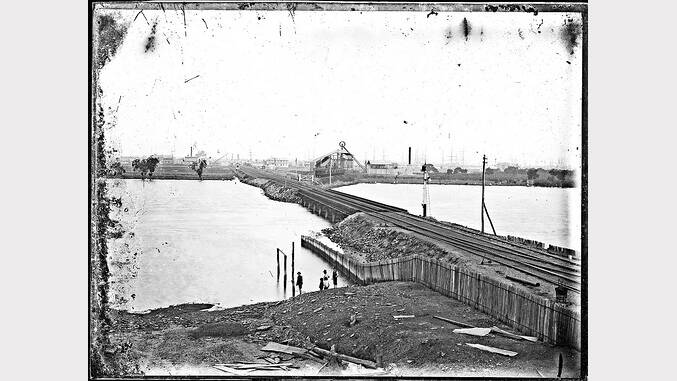 ARCHIVAL REVIVAL 1900s: Photographs from the Newcastle Herald's files.  Cowper Street Bridge The original Cowper street coal railway bridge to Carrington, above, in about 1909. 