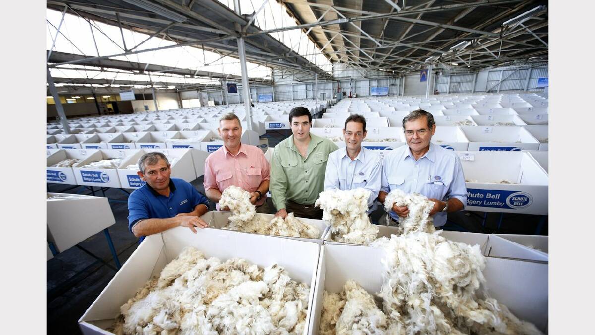 FOND MEMORIES: From left, Harold Manttan of the Australian Wool Network, Craig Brennan of Elders Wool, Matt Thomas of Landmark and David Cross and Tony Evans of Schute Bell Badgery Lumby  are sad to see the end of wool sales in Newcastle, after 70 years at the Hannell Street site. Picture: Dean Osland