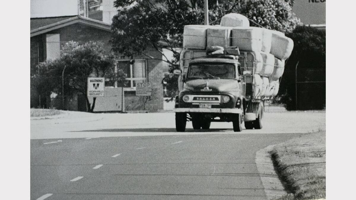 A truckload of wool driven through a Newcastle street. 