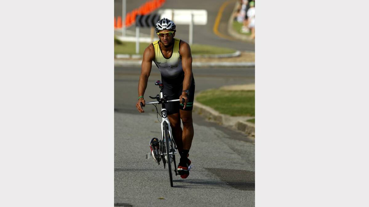 ENERGY: Action from the Sparke Helmore NBN Triathlon in Newcastle on Sunday.  winner of the Olympic Distance Triathlon race, Nathan Miller, coasting into the changeover after the cycling leg. Picture Max Mason Hubers.