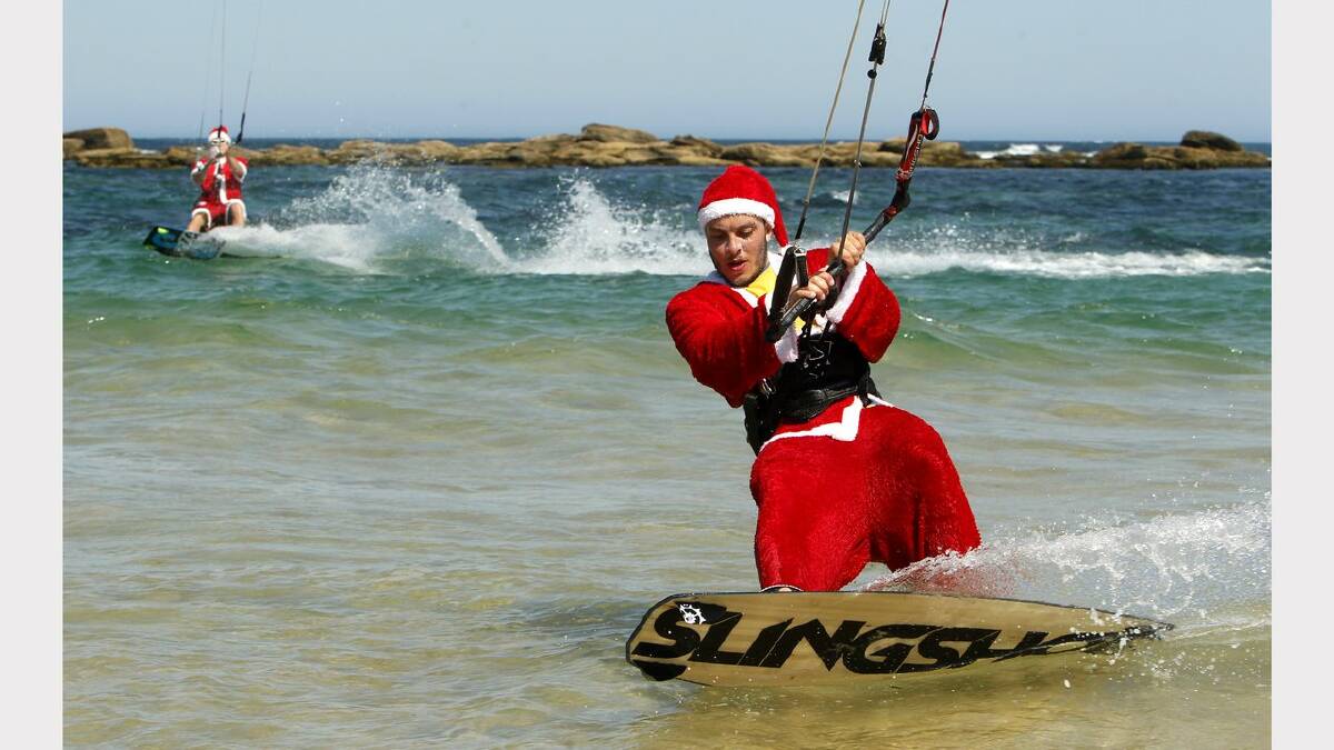 Kite-surfing Santas at Nobbys Beach, Newcastle. Franz Riembauer, top left, Mitchell Williams, right, in action. Picture Jonathan Carroll. 