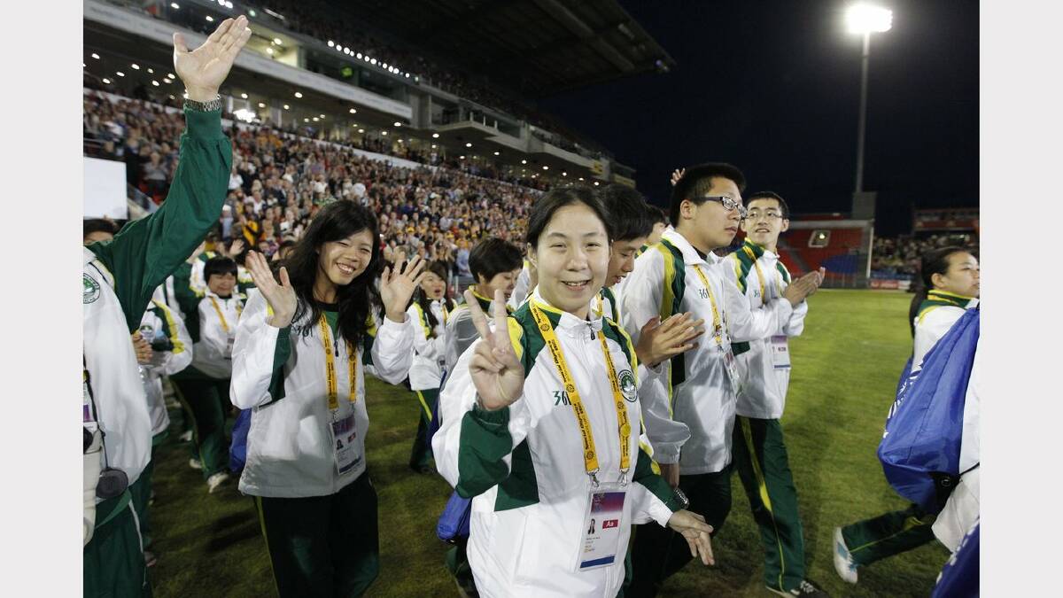 The opening ceremony of the Special Olympics on Sunday night. Athletes from Macau arrive at the stadium. Picture Jonathan Carroll
