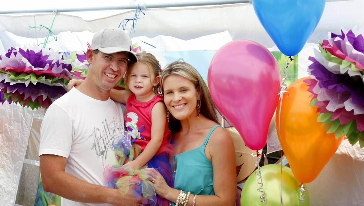 BEST WISHES: Daniel and Jessica Boyson of Lambton with their daughter Mollyjane at her third birthday party. Mollyjane has carnitine-acylcarnitine  translocase deficiency.   Picture: Dean Osland