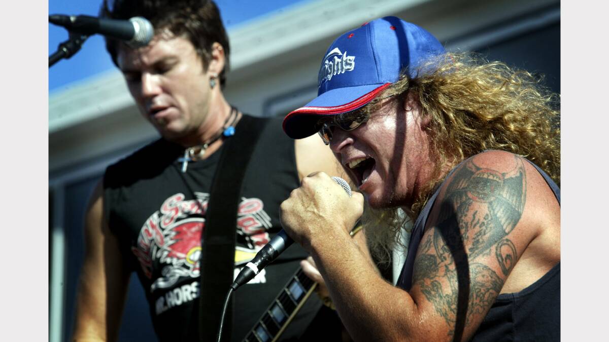 MUSICAL MATES: Grant Walmsley and Dave Gleeson of the Screaming Jets perform at the Newcastle Knights home game against the Warriors in 2005. 