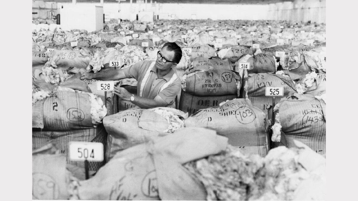 Dalgety wool bales wating to be sold Foreman looking at wool waiting to be sold 
