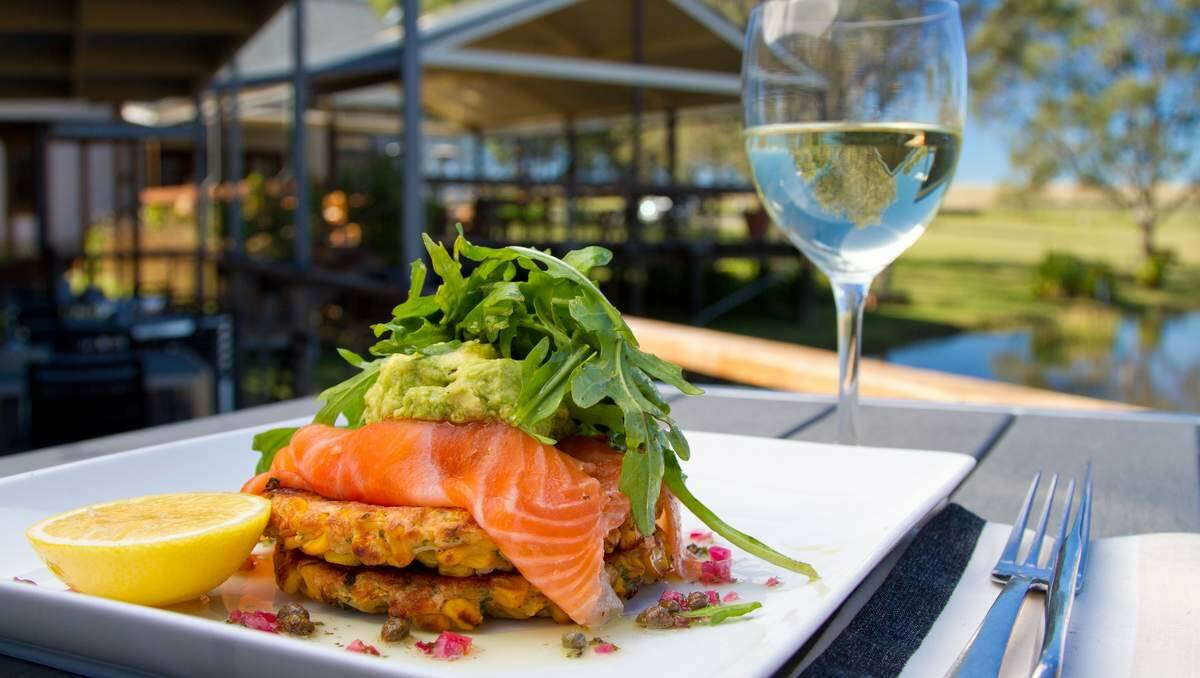 MODERN TWIST: The Deck Cafe’s corn frittas with house cured salmon gravlax, smashed avocado, baby caper and Spanish onion salsa and citrus cream.  Picture: Flashme Web Design and Photography