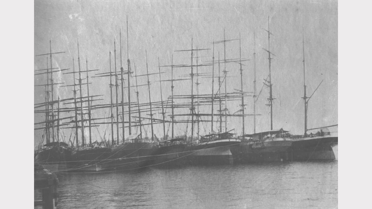 ARCHIVAL REVIVAL 1900s: Photographs from the Newcastle Herald's files.  Seven sailing ships are lashed together, moored at the Stockton ballast ground jetties in October 1900.