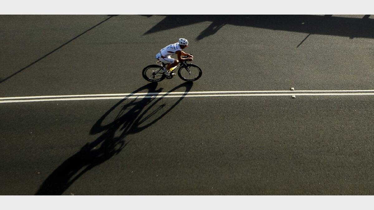 ENERGY: Action from the Sparke Helmore NBN Triathlon in Newcastle on Sunday.  a competitor on Shortland Esplanade during the cycling leg of the Olympic Distance Triathlon race.Picture Max Mason Hubers.