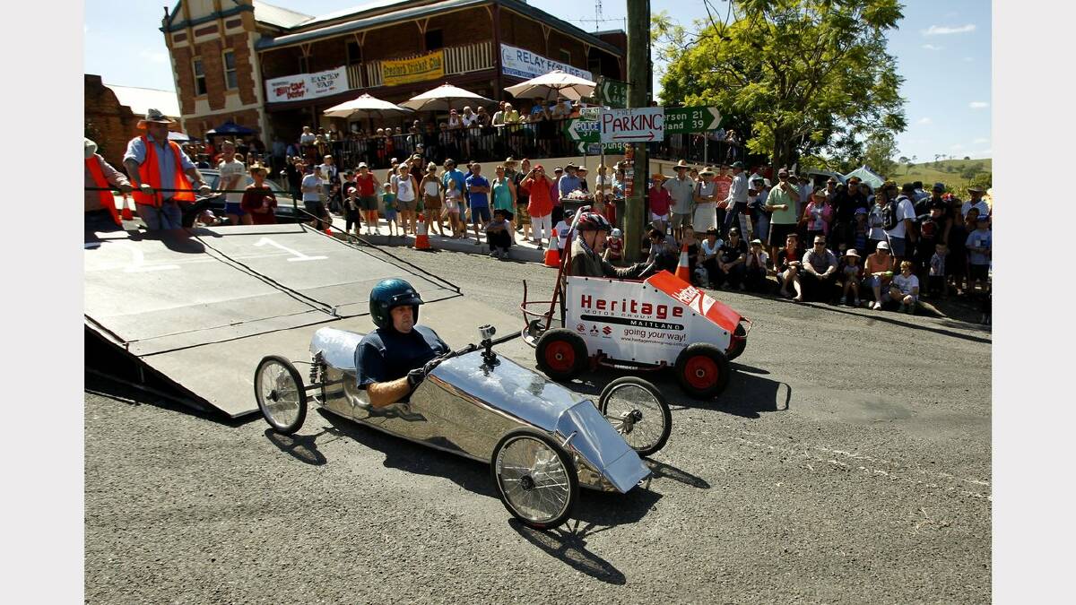SILVER STREAK: Phillip Foote from Morpeth in the silver billy cart, he is racing Michael Taylor from Bar Beach, in the Heritage billy cart at Grestford on Saturday. Picture Jonathan Carroll