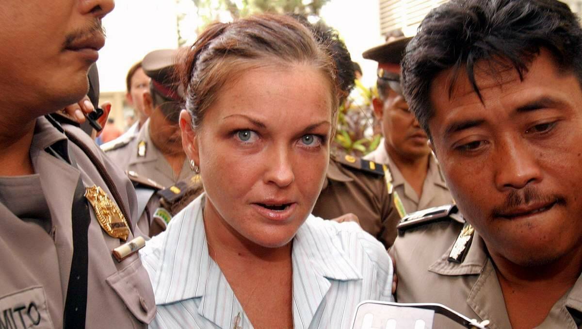  THE SPOTLIGHT: Schapelle Corby is escorted by jail officers as she walks to her cell. 