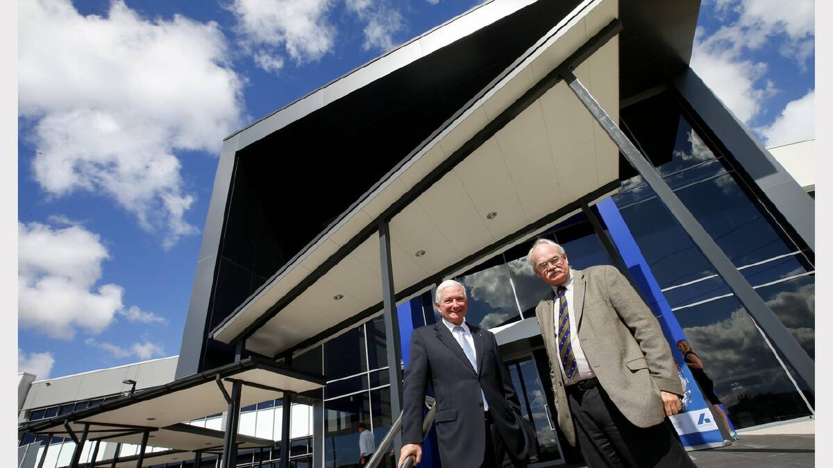 GLOBAL HQ: Infrastructure NSW chairman Nick Greiner, left, and Bradken CEO Brian Hodges, at the  launch of  the $18m new headquarters of mining and rail engineers Bradken on Tuesday at Steel River.  Picture by DEAN OSLAND