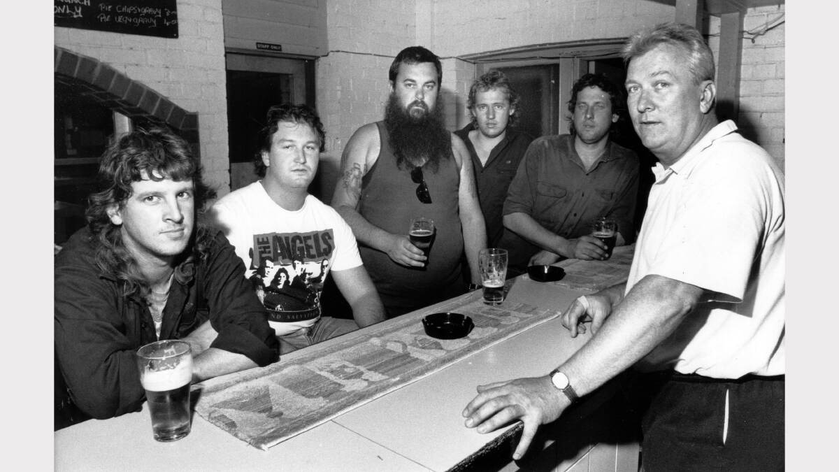 Alcan aluminium smelter workers Geoff Logan, Rick Madden, Geoff Baker, Adrian "Spider" Stahlenhoef and Gary Brown with publican Tony Ginty at the Chelmsford Hotel, Kurri Kurri, on 30 October 1991. Picture John Herrett. 