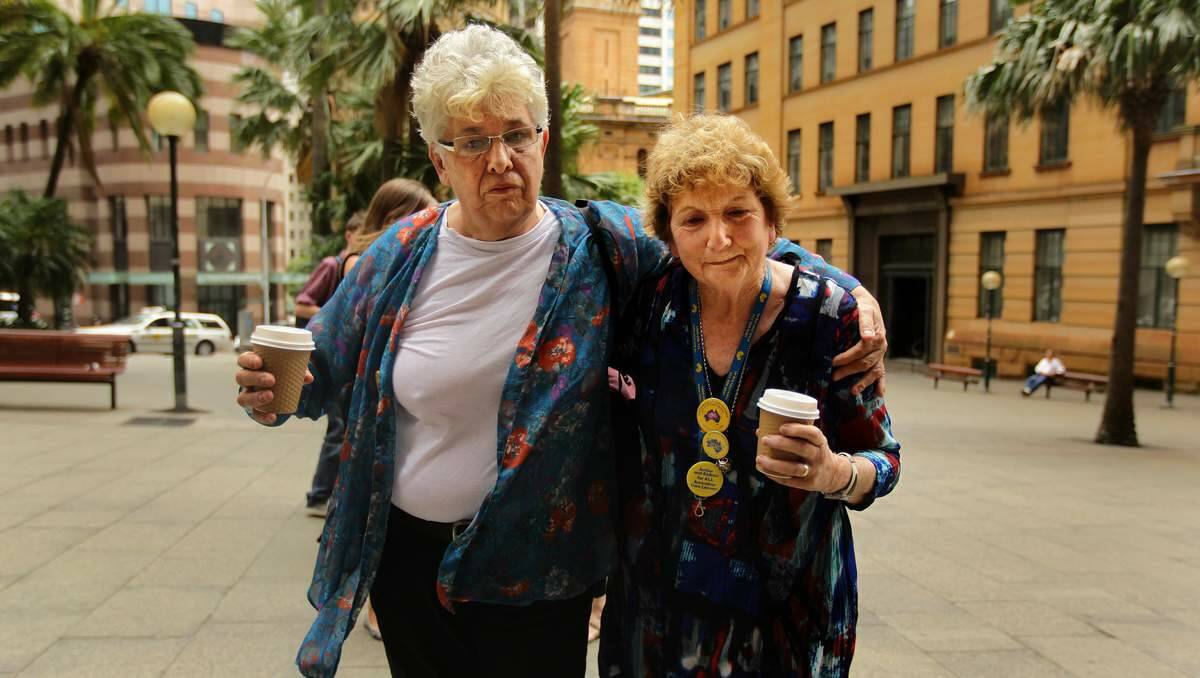 SURVIVORS: Eyvette Parr and Trish Charter, survivors of institutional abuse, comfort each other outside the Royal Commission in Sydney.  Picture: Kate Geraghty