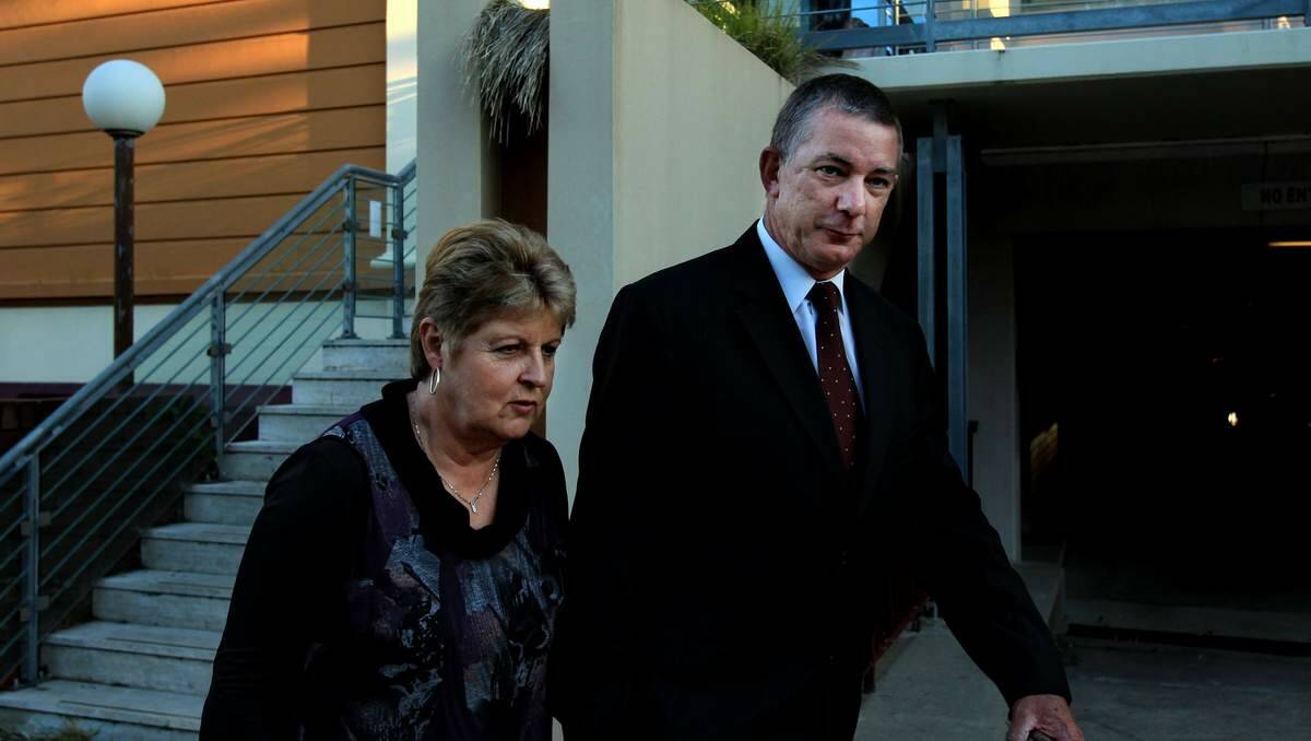  UNDER FIRE: Detective Chief Inspector Peter Fox leaves the inquiry with wife Penny yesterday.  Picture: Simone De Peak
