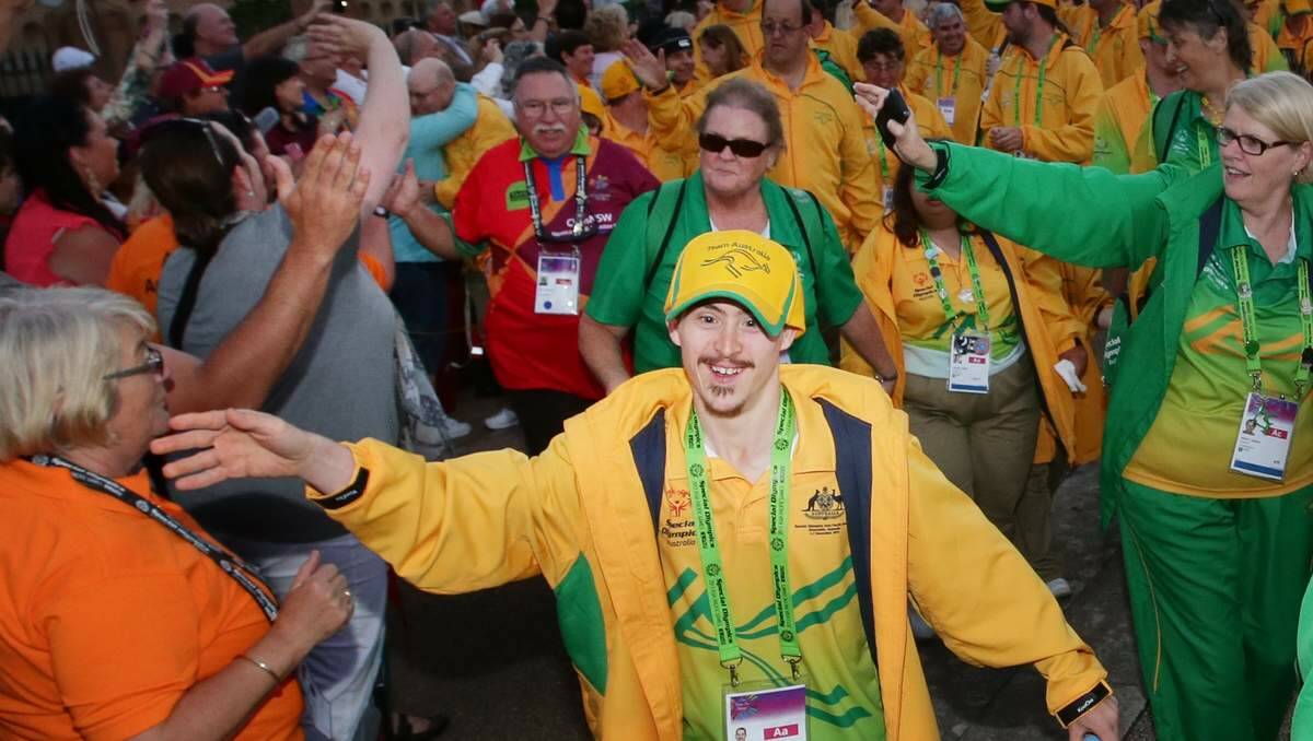 CELEBRATION: Exuberant athletes arrive at Customs House after taking part in the Special Olympics Asia Pacific Games closing ceremony parade.  Pictures: Peter Stoop