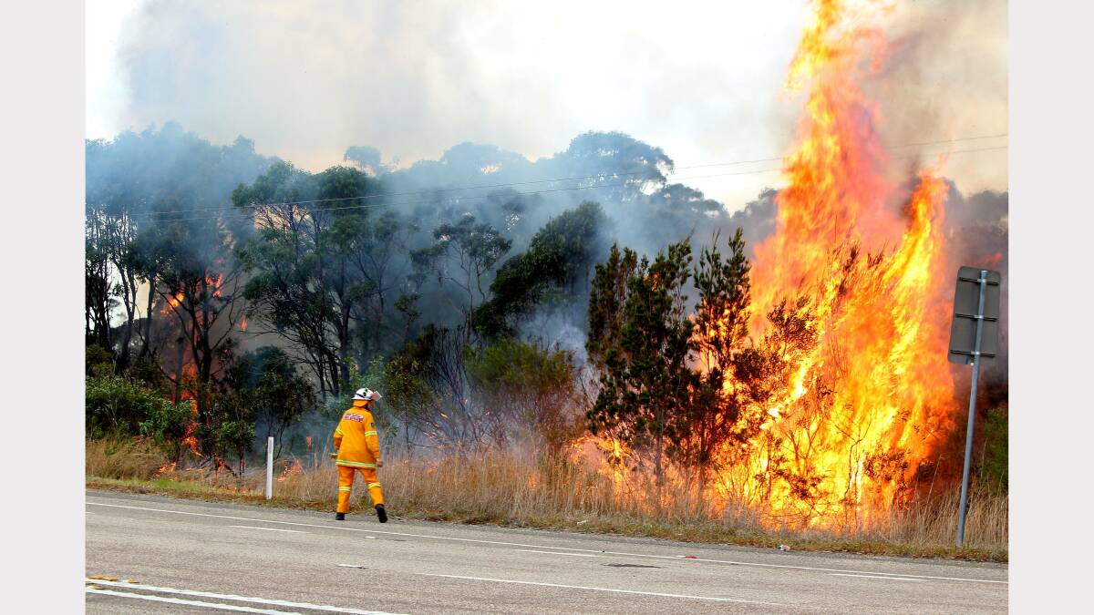 Scenes from the fires at Catherine Hill Bay and Chain Valley Bay on Friday. Photo by Phil Hearne