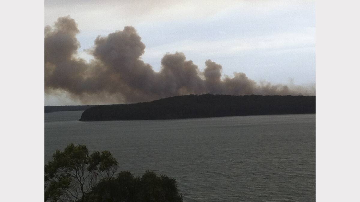 Supplied pic of Lake Munmorah fire from Wangi over Pulbah Island. Photo: Jason Gordon