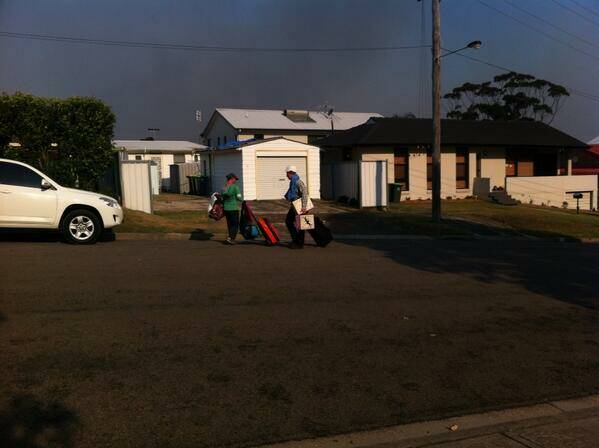 Residents Susan Denholm and her son Linden leaving Boundary Street Dudley as the fire is only 300 metres from their homes. Picture by Matt Kelly