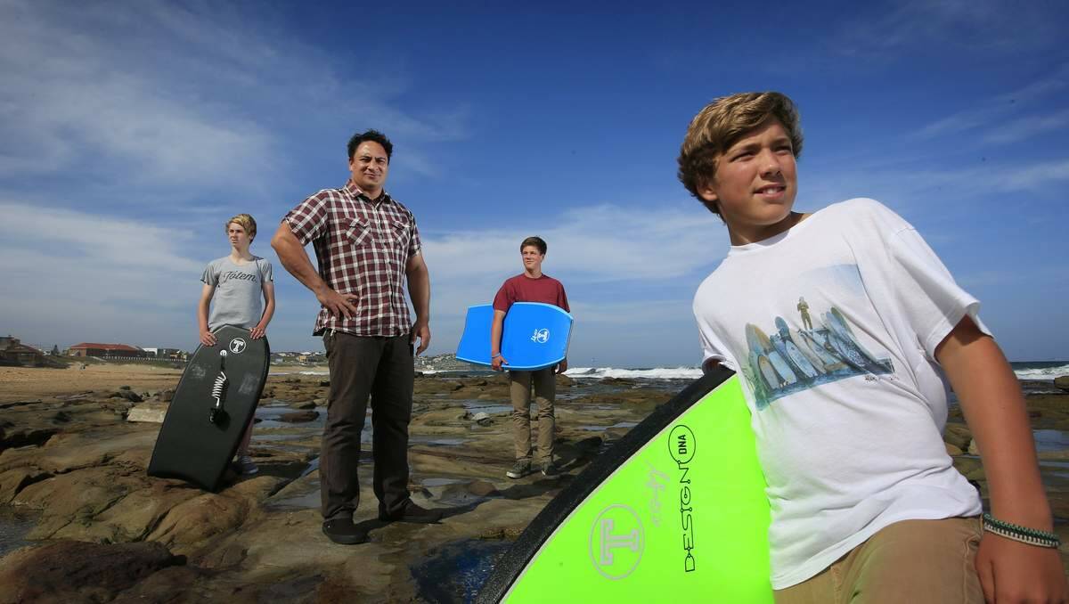 LOCATION: Totem founder Dan Agelavu, centre, with boarders, from left, Jake Evans, Rhys Wilson and Sebastian Kavanagh.