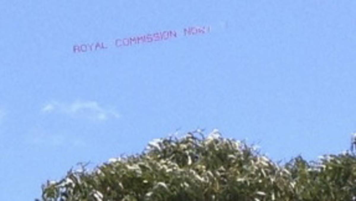 COMMITTED: A plane tows a banner pushing for a Royal Commission backed by Clergy Abuse Network co-founder Bob O’Toole.