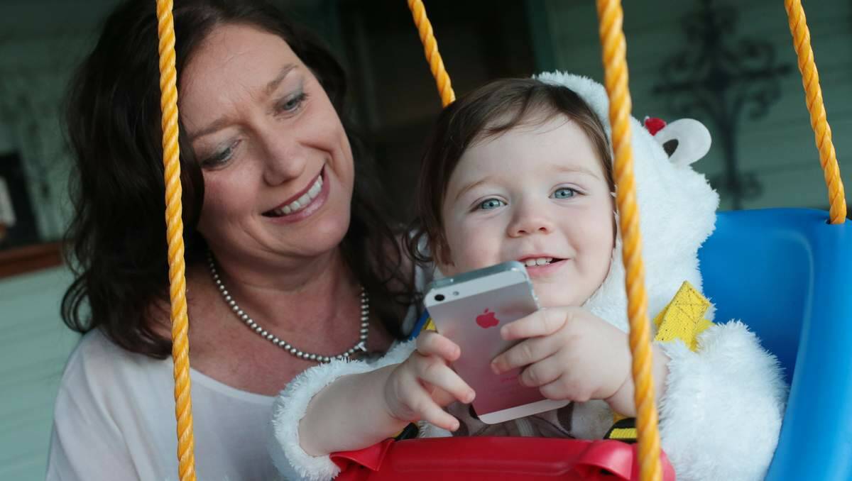 APT: Tara O’Connell, pictured with son Alexander, has launched a new baby app. Picture: Dean Osland