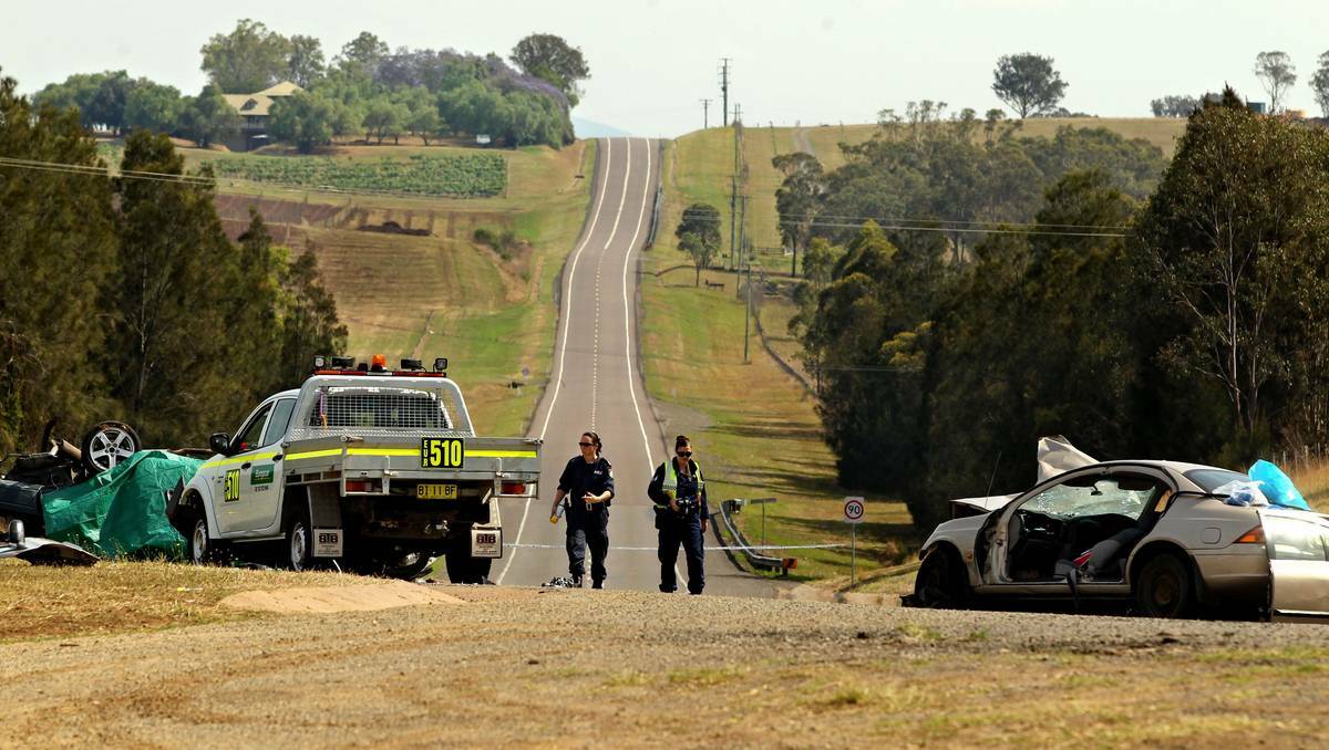 CARNAGE: Police at the scene of the three-vehicle crash in which a coal miner on his way to work was killed.  Picture: Simone De Peak