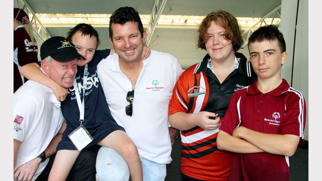 Major General Mick Slater and SOA Chairman Mark Streeting meet some of the athletes at the pool. Picture: Peter Muhlbock / Special Olympics Australia