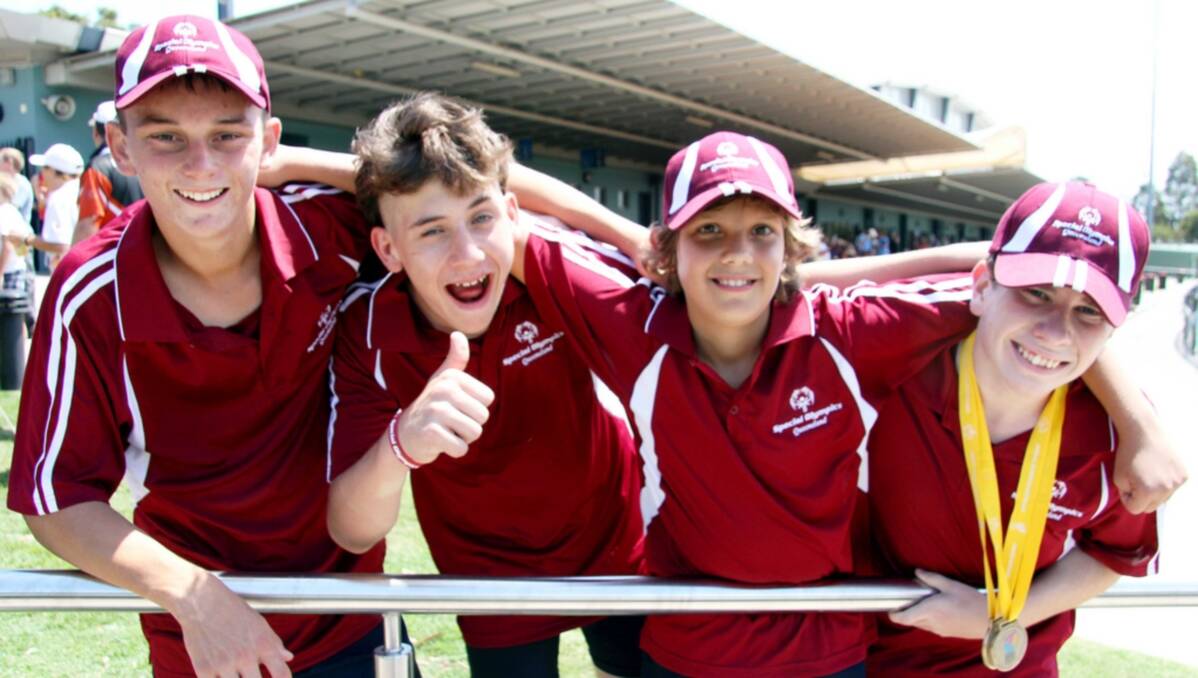 Joshua Holloway, Justin Mykkelttedt, Joshua Lush and Matthew Burge enjoy the athletics. Picture: Peter Muhlbock / Special Olympics Australia
