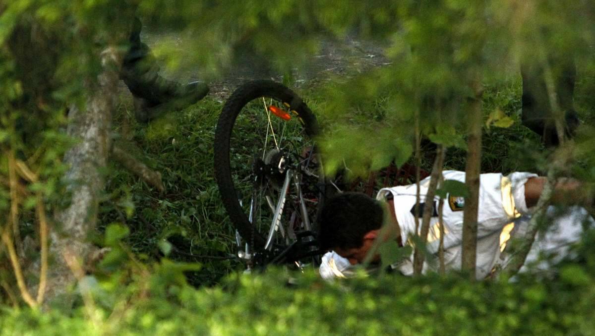 MYSTERY: Investigators at the Toronto cycleway where the man died.