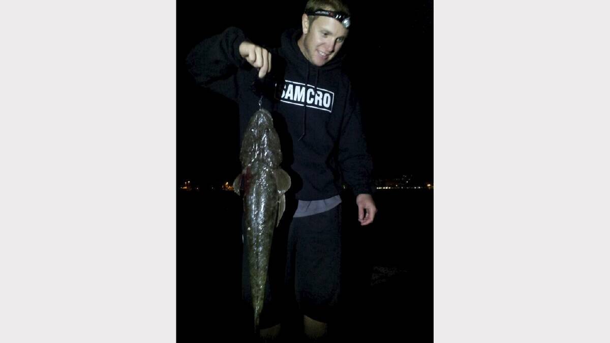 FLAT OUT: Chris Hall with a 72cm flathead hooked  on Stockton breakwall using prawns. Submitted 30/1/13.