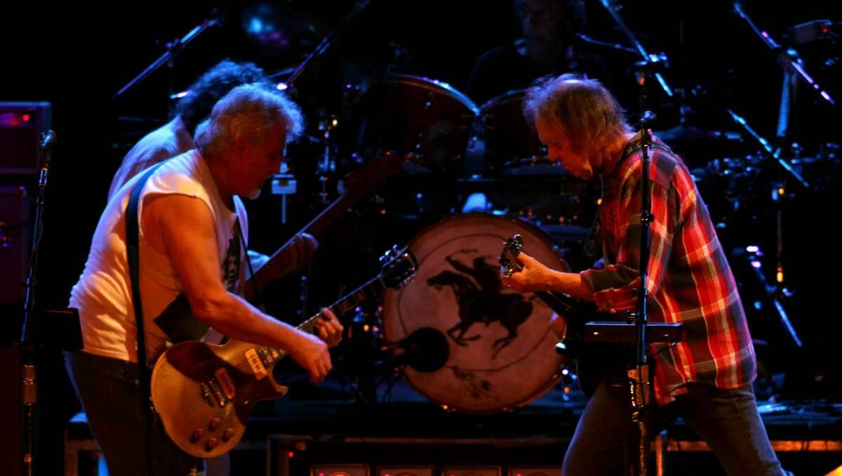 WILD RIDE: Neil Young in action with Crazy Horse on Saturday night. Picture: Simone De Peak