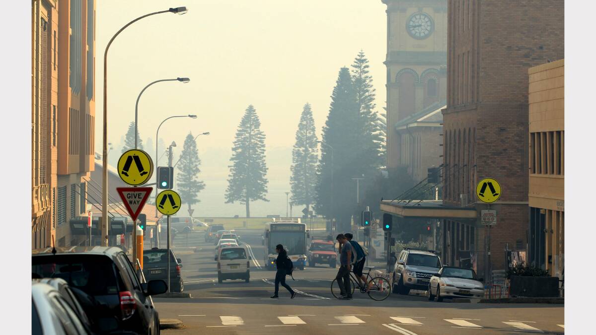 SMOKE GETS IN OUR EYES: Newcastle is shrouded in the fallout from the Heatherbrae fire. Pictures by Simone De Peak