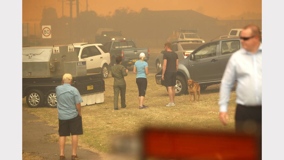 CHAOS: Scenes from Williamtown as a fire breaks containment lines. Pictures by Jonothan Carroll
