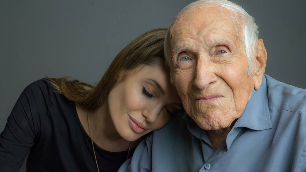 Angelina Jolie, the director of the new movie, Unbroken with  the hero of the story Louis Zamperini. Photo: Universal Pictures.
