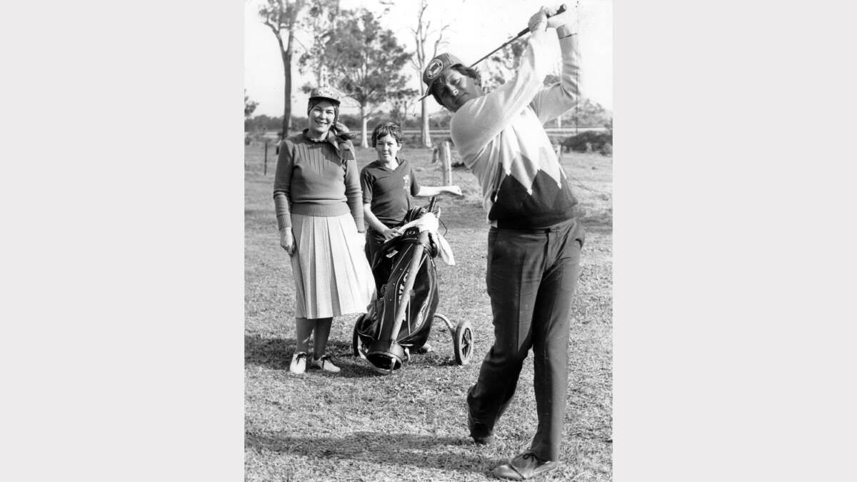 Jack Newton shows Newcastle lord mayor Joy Cummings and caddy Gavin Croush of Beresfield how to use an iron at the opening of the 11-hole Beresfield golf course on June 4, 1983.
