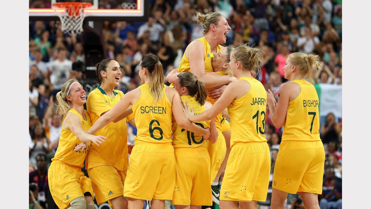 Suzi Batkovic jumps for joy as Australia win bronze in women's basketball at London.
