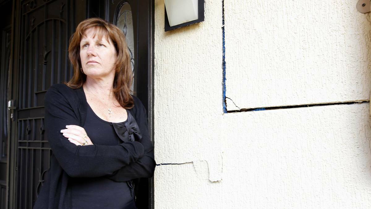 Sonya Mancinelli with the crack inside her Lambton Gardens home. Picture Darren Pateman.
