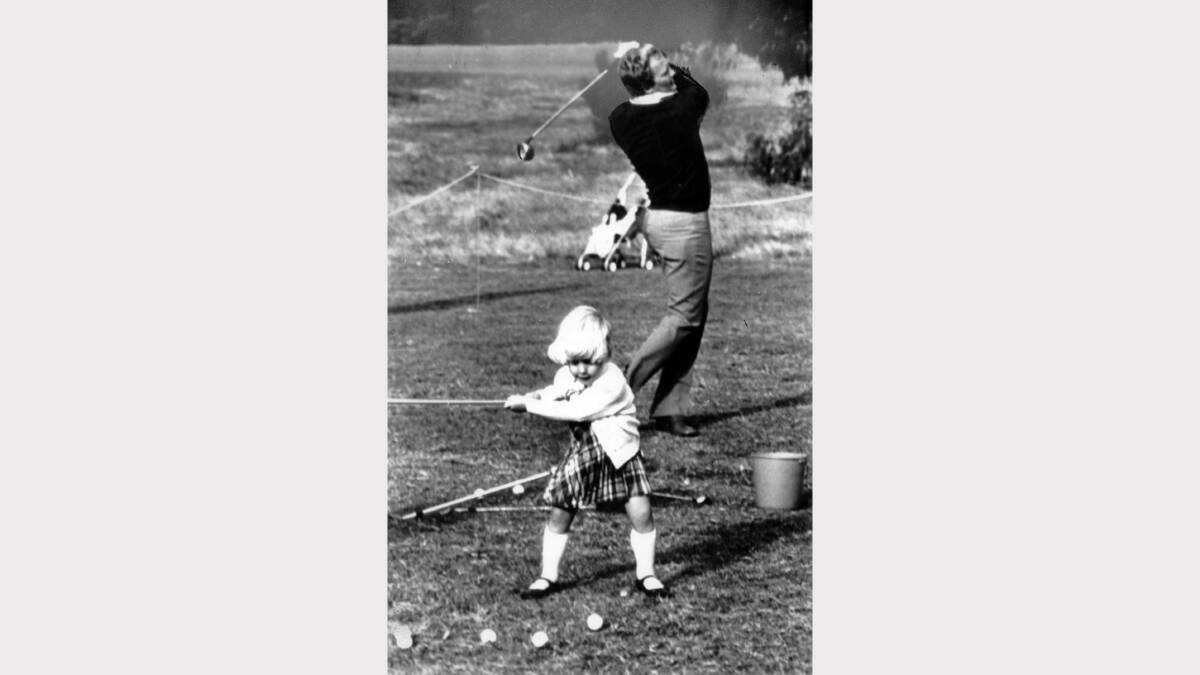 Jack Newton and three-year-old daughter Kristie on a practice fairway during the Australian Open in 1981.