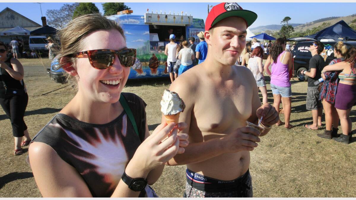 Sarah Frost, of Newcastle, and Matthew Fraser-Bell, of Hornsby, cool off with an ice-cream at the Gentlemen of the Road festival at Dungog on Saturday. Picture: Peter Stoop