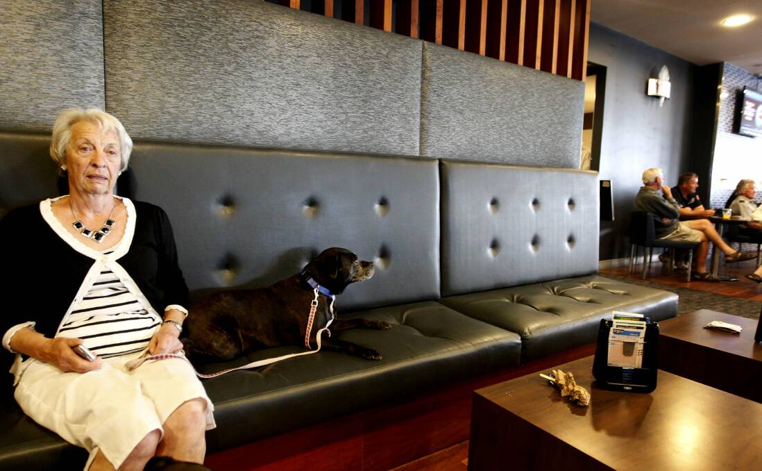 June Hammond, of Murrays Beach, with her dog Pebbles at the Swansea RSL evacuation centre. Picture: Darren Pateman