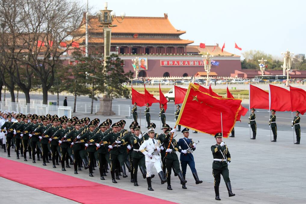 Honour guard troops march during a welcome ceremony for Australia's Prime Minister Julia Gillard outside the Great Hall of the People in Beijing, China. Photo: Getty Images