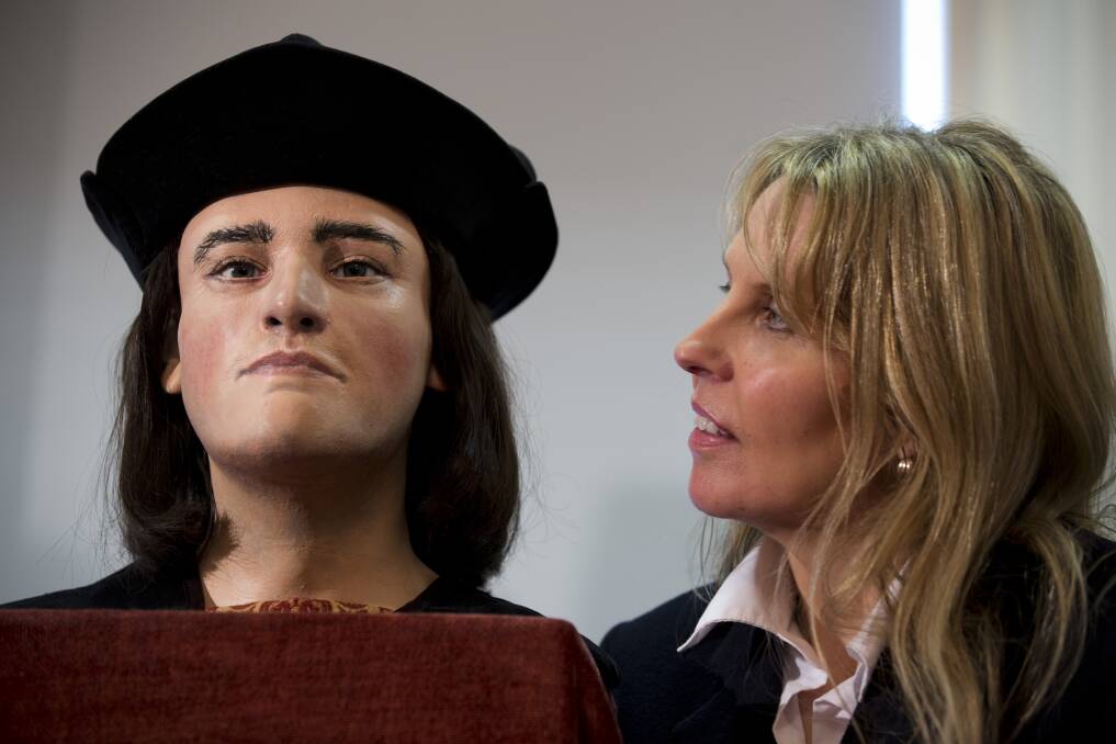 Richard III Society member Philippa Langley stands besides a facial reconstruction of King Richard III before it is unveiled by the Richard III Society in London, England. Photo by Dan Kitwood/Getty Images