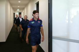 Kalyn Ponga, followed by his father and manager Andre, at his contract extension announcement in 2022. Picture by Jonathan Carroll